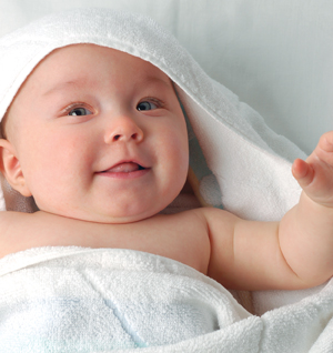 Baby wrapped in soft towel.