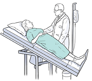 Health care provider doing tilt table test with patient.