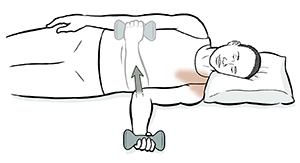 Man lying on side doing internal rotation shoulder exercise with hand weight. 