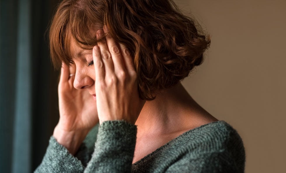 Woman suffering from migraine